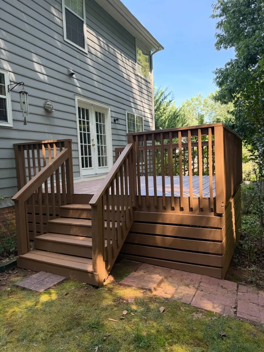Wood deck, stairs and railing stained a warm brown