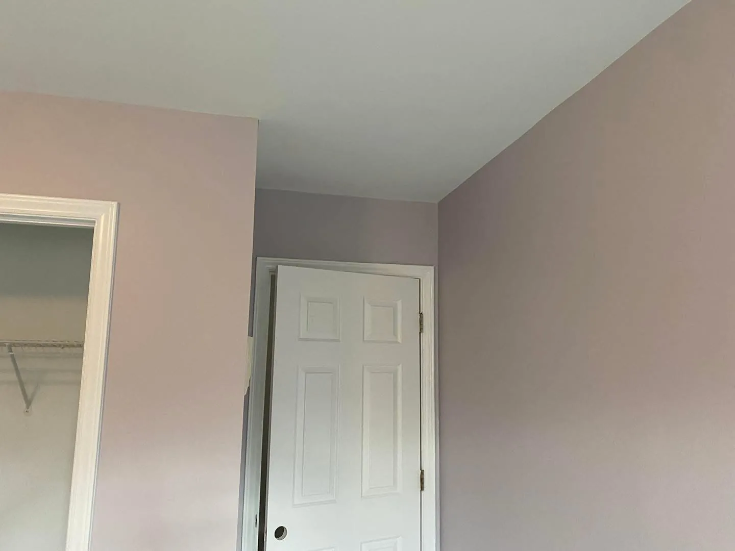 Bedroom repainted after a water-damaged ceiling was repaired